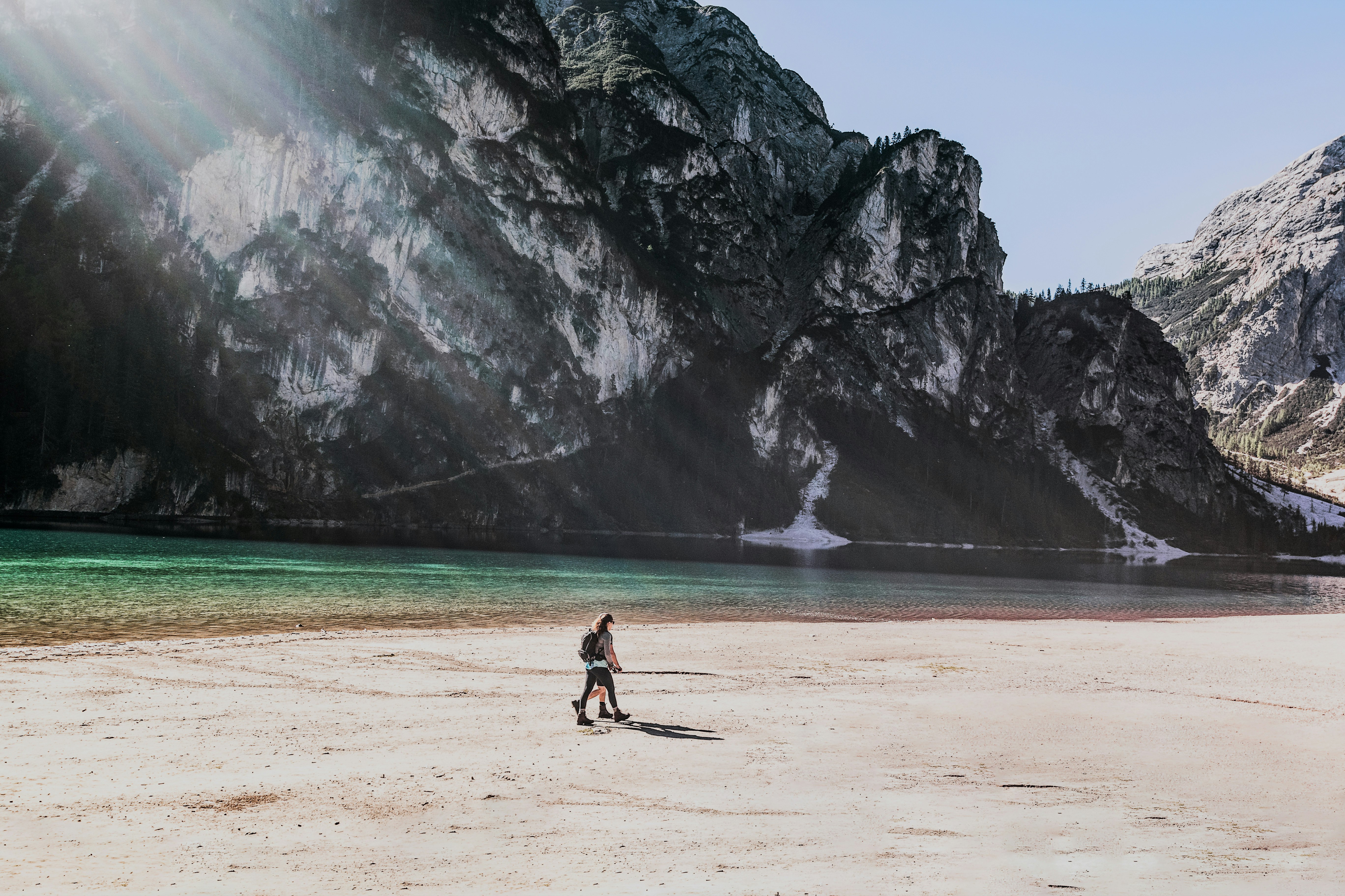 two people walks on beach